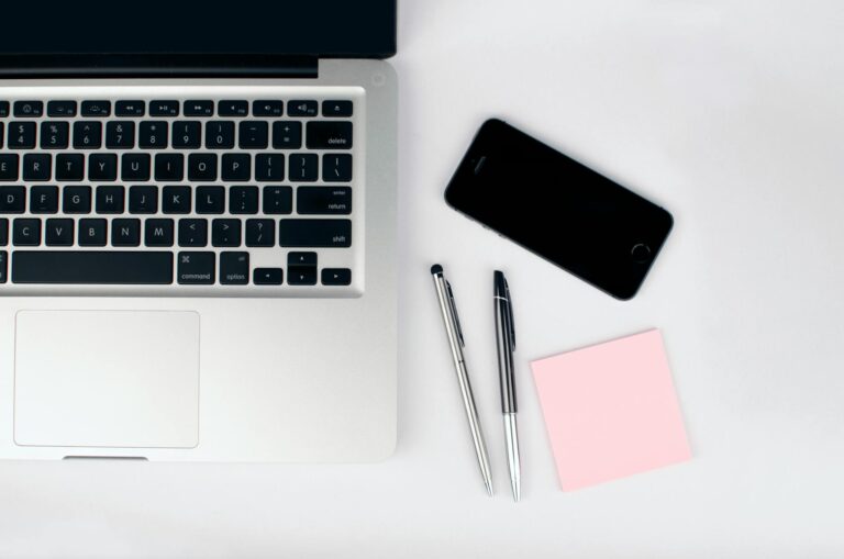 two pens beside macbook